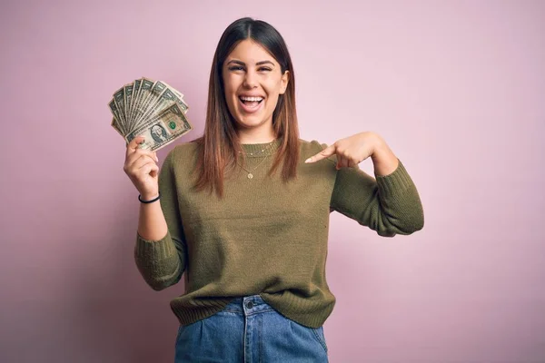 Young Beautiful Woman Holding Dollars Standing Isolated Pink Background Surprise — 스톡 사진