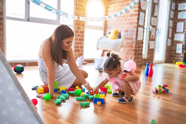 Young Beautiful Teacher Toddler Sitting Floor Playing Building Blocks Toy — Stock Photo, Image