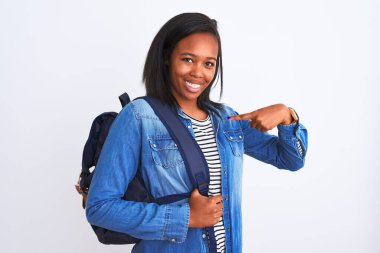 Young african american student woman wearing backpack over isolated background with surprise face pointing finger to himself