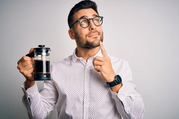 Young Handsome Man Making Coffee Using French Press Coffeemaker Isolated — Stok fotoğraf