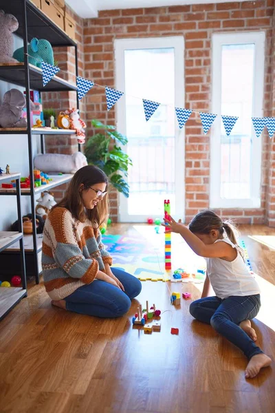 Beautiful Teacher Toddler Playing Wooden Blocks Train Lots Toys Kindergarten — Stock Photo, Image