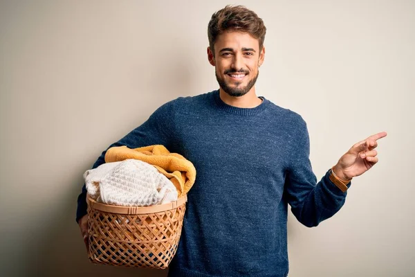 Young Man Doing Housework Holding Wicker Basket Clothes White Background — Stock Photo, Image