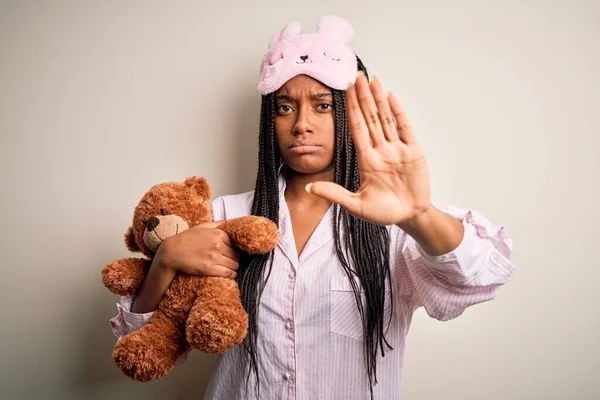 Young African American Woman Wearing Pajama Eye Mask Hugging Teddy — 图库照片