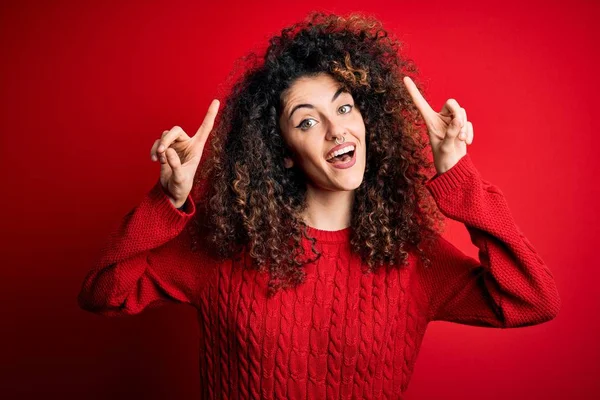 Young Beautiful Woman Curly Hair Piercing Wearing Casual Red Sweater — 图库照片