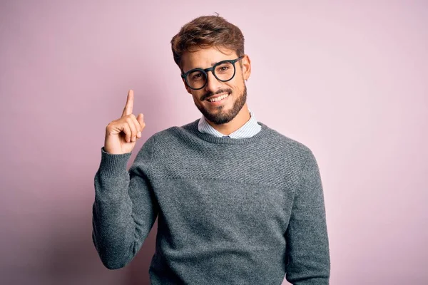 Young Handsome Man Beard Wearing Glasses Sweater Standing Pink Background — Stockfoto