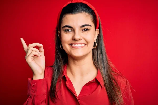 Young Beautiful Brunette Woman Wearing Casual Shirt Diadem Red Background — Stockfoto