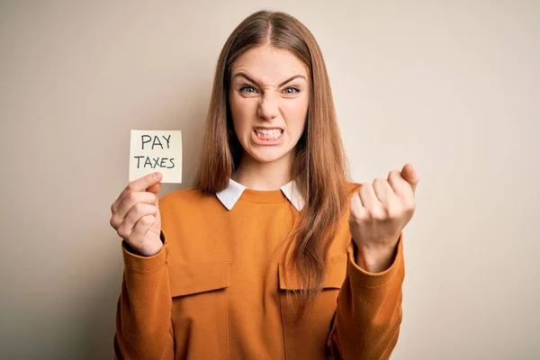 Young Beautiful Blonde Woman Holding Pay Taxes Goverment Reminder Yellow — Stock Photo, Image