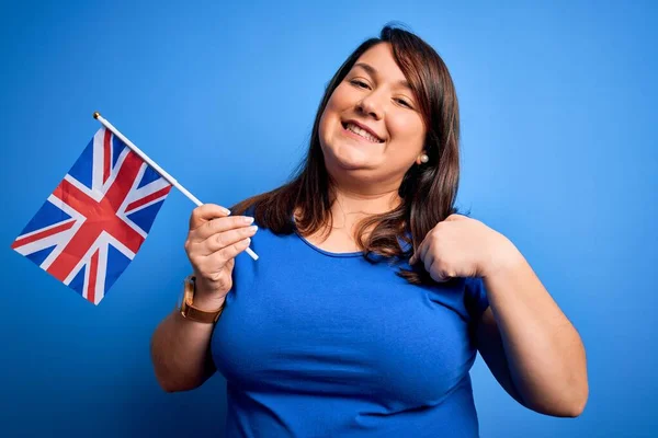 Beautiful Size Woman Holding United Kingdom Flag Blue Background Surprise — Stok fotoğraf