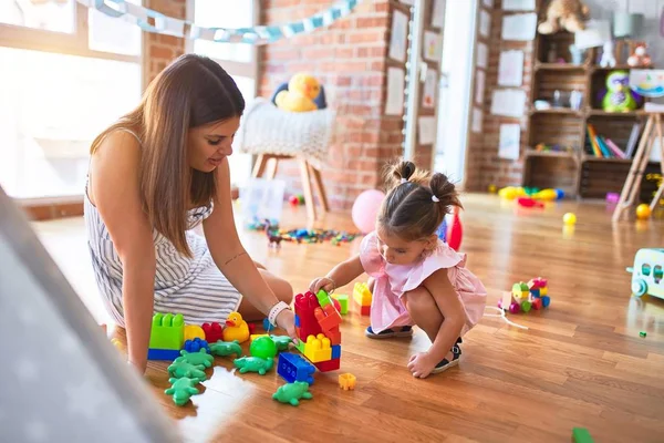 Young Beautiful Teacher Toddler Sitting Floor Playing Building Blocks Toy — Stock Photo, Image