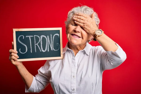 Senior Beautiful Woman Holding Blackboard Strong Message Isolated Red Background — Stock Photo, Image