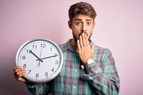 Young Man Beard Doing Countdown Using Big Clock Isolated Pink — 스톡 사진