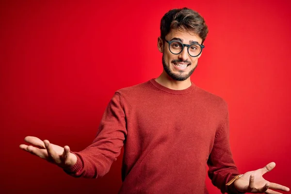 Young Handsome Man Beard Wearing Glasses Sweater Standing Red Background — Stock Photo, Image