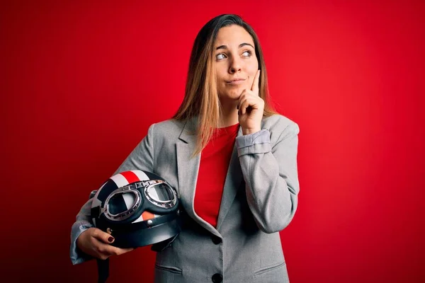 Young Beautiful Blonde Motorcyclist Woman Holding Motorcycle Helmet Red Background — ストック写真