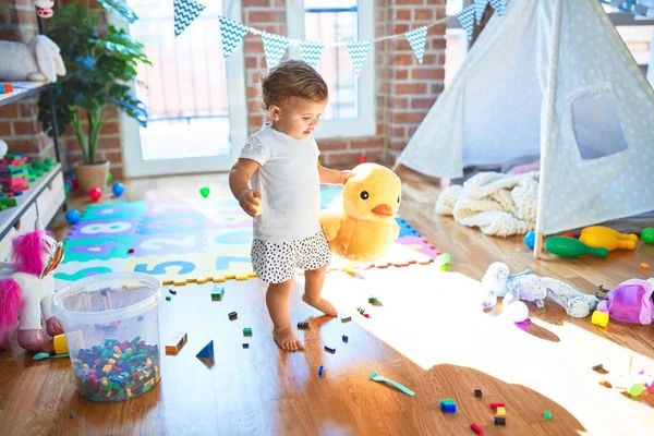 Adorable Toddler Holding Duck Doll Standing Lots Toys Kindergarten — Stock Photo, Image