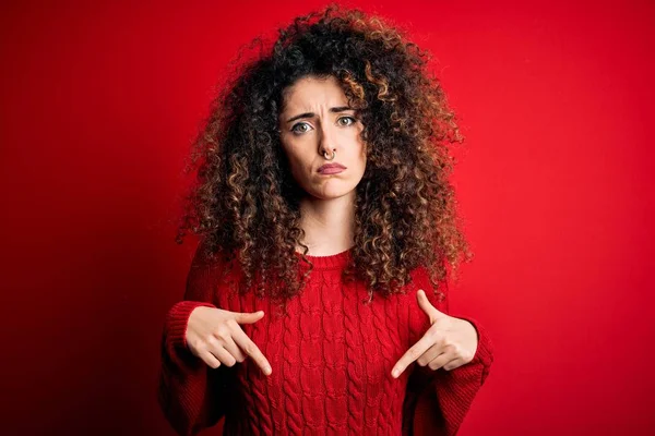 Young Beautiful Woman Curly Hair Piercing Wearing Casual Red Sweater — ストック写真