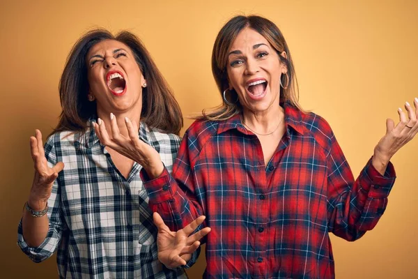 Middle Age Beautiful Couple Sisters Wearing Casual Shirt Isolated Yellow — Stock Photo, Image