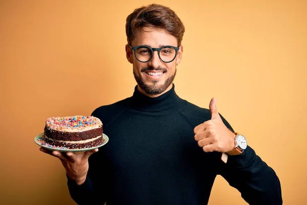 Young Man Beard Wearing Glasses Holding Birthday Cake Isolated Yellow — Stock Photo, Image