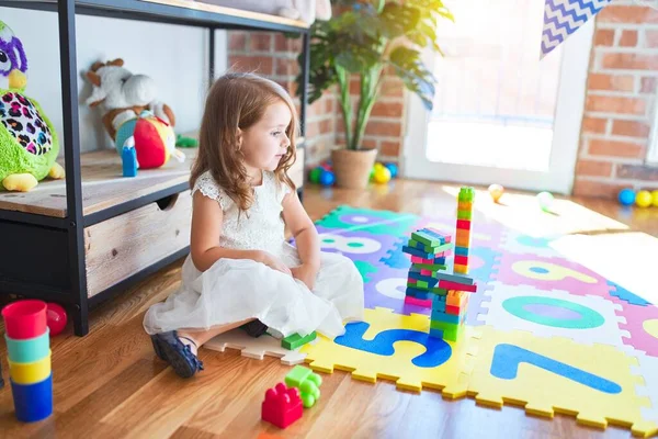 Adorable Blonde Toddler Playing Building Blocks Toy Lots Toys Kindergarten — Stock Photo, Image