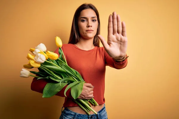 Young Beautiful Brunette Woman Holding Bouquet Tulips Flowers Yellow Background — Stock Photo, Image