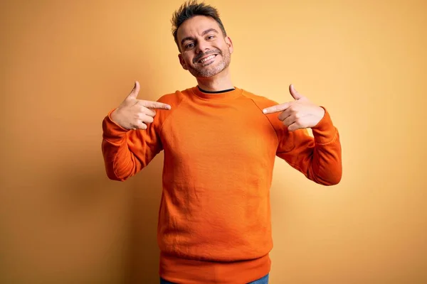 Young Handsome Man Wearing Orange Casual Sweater Standing Isolated Yellow — Stock Photo, Image