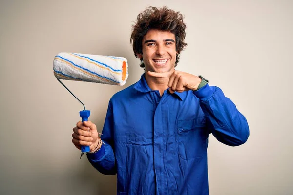 Young Handsome Painter Man Holding Roller Wearing Uniform Isolated White — Stock Photo, Image