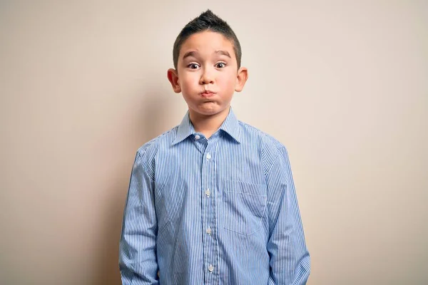 Jovem Garoto Vestindo Camisa Elegante Sobre Fundo Isolado Soprando Bochechas — Fotografia de Stock