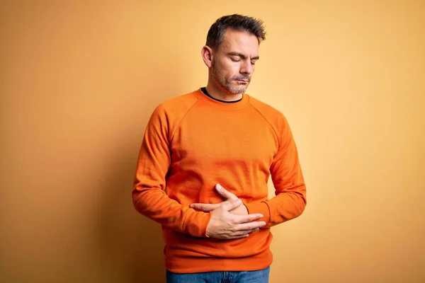 Young Handsome Man Wearing Orange Casual Sweater Standing Isolated Yellow — Stock Photo, Image