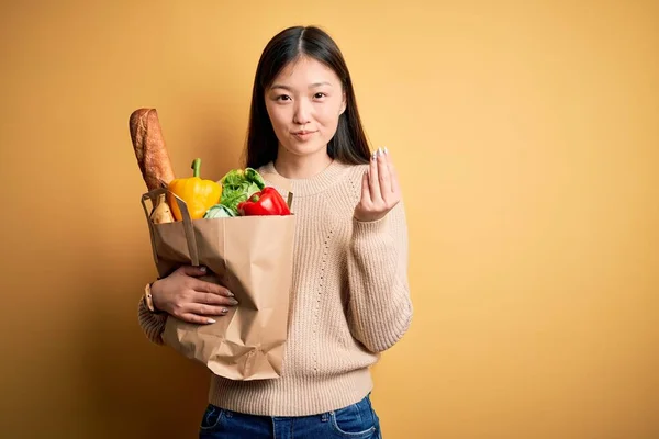 Young Asian Woman Holding Paper Bag Fresh Healthy Groceries Yellow — Stock Photo, Image