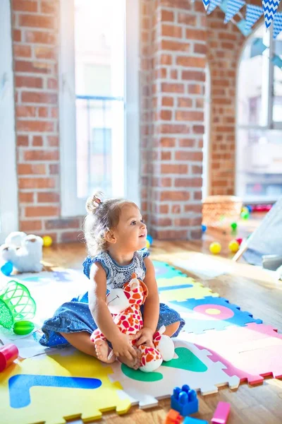 Adorable Toddler Smiling Happy Sitting Floor Playing Giraffe Doll Lots — Stock Photo, Image