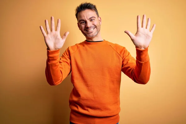 Young Handsome Man Wearing Orange Casual Sweater Standing Isolated Yellow — Stock Photo, Image