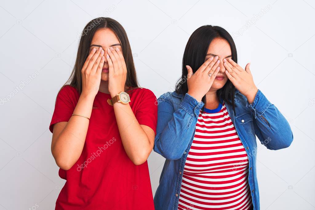 Young beautiful women wearing casual clothes standing over isolated white background rubbing eyes for fatigue and headache, sleepy and tired expression. Vision problem