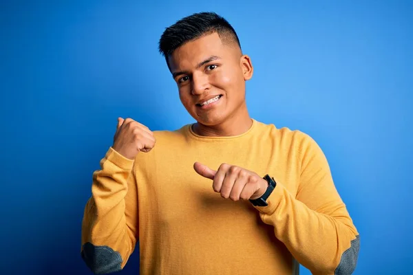 Young Handsome Latin Man Wearing Yellow Casual Sweater Isolated Blue — Stock Photo, Image