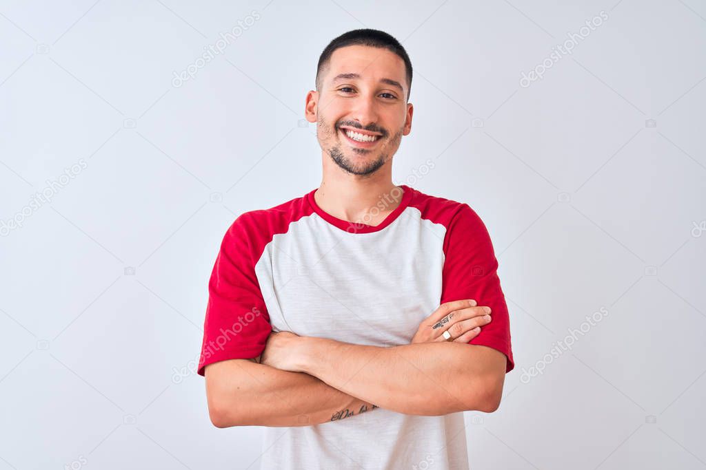 Young handsome man standing over isolated background happy face smiling with crossed arms looking at the camera. Positive person.