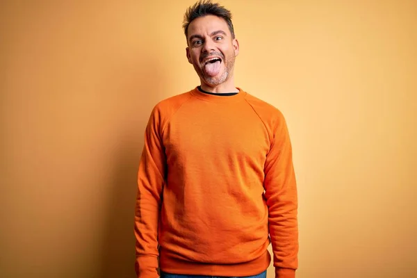 Young Handsome Man Wearing Orange Casual Sweater Standing Isolated Yellow — Stock Photo, Image