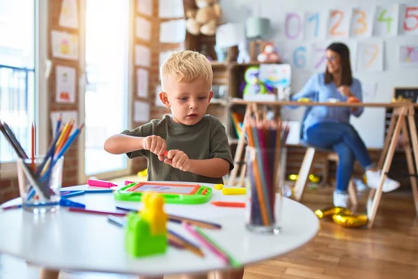 Young Caucasian Child Playing Playschool Teacher Mother Son Playroom Drawing — Stockfoto