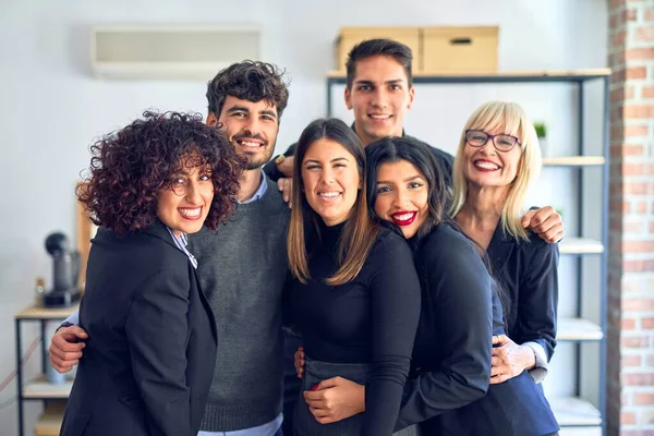 Group of business workers smiling happy and confident. Posing together with smile on face looking at the camera at the office