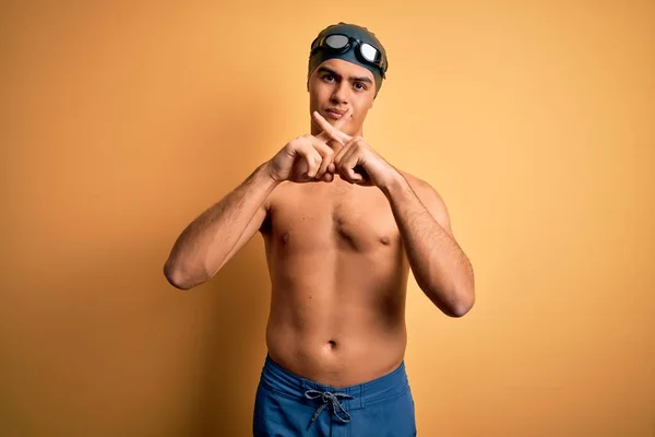 Young Handsome Man Shirtless Wearing Swimsuit Swim Cap Isolated Yellow — Stock Photo, Image