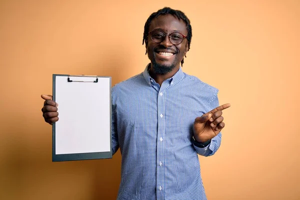 Young African American Inspector Man Wearing Glasses Holding Clipboard Checklist — Stockfoto
