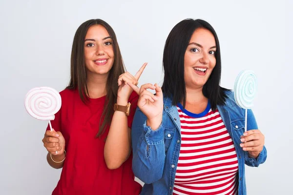 Young Beautiful Women Holding Sweet Lollipop Standing Isolated White Background — Stock Photo, Image