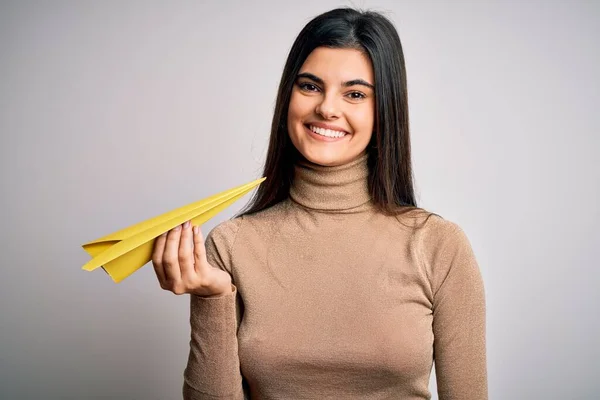 Young Beautiful Brunette Woman Holding Paper Airplane Isolated White Background — Stock Photo, Image