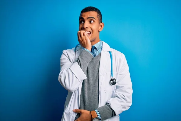 Handsome African American Doctor Man Wearing Coat Stethoscope Blue Background — Stock Photo, Image