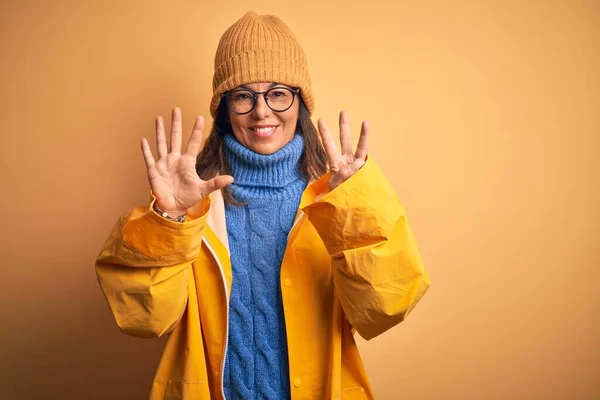 Middle Age Woman Wearing Yellow Raincoat Winter Hat Isolated Background — Stock Photo, Image