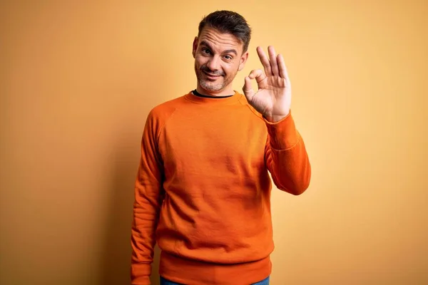 Young Handsome Man Wearing Orange Casual Sweater Standing Isolated Yellow — Stock Photo, Image