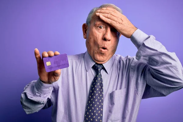 Senior Grey Haired Business Man Holding Credit Card Purple Background — Stock Photo, Image