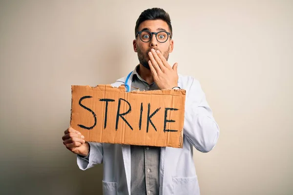 Young Handsome Doctor Man Protesting Holding Cardboard Strike Message Cover — Stock Photo, Image