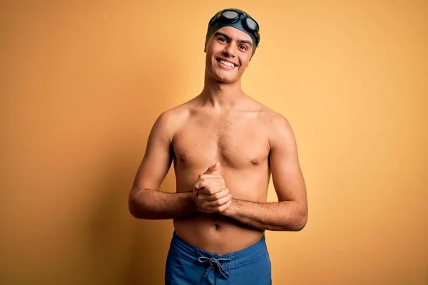 Young Handsome Man Shirtless Wearing Swimsuit Swim Cap Isolated Yellow — Stock Photo, Image