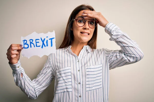 Young Beautiful Brunette Woman Holding Paper Brexit Message White Background — Stock Photo, Image
