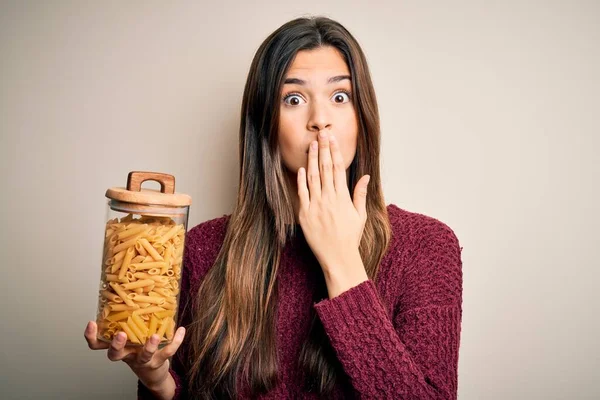 Young Beautiful Girl Holding Bottle Dry Italian Pasta Macaroni White — Stock Photo, Image