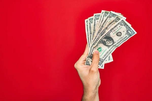 Bela Mão Homem Segurando Monte Notas Dólar Sobre Fundo Vermelho — Fotografia de Stock