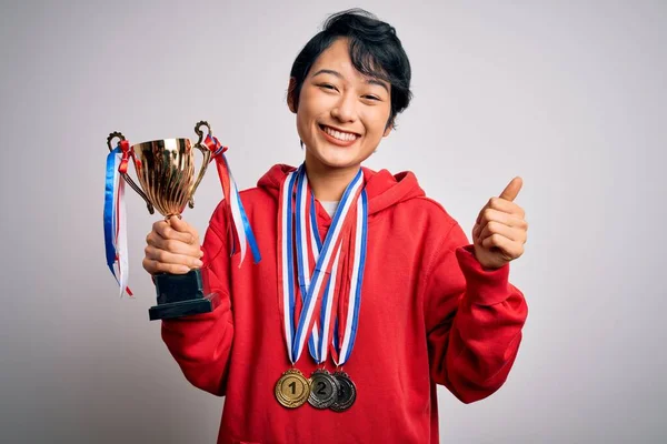 Young Beautiful Asian Girl Winner Holding Trophy Wearing Medals White — Stock Photo, Image